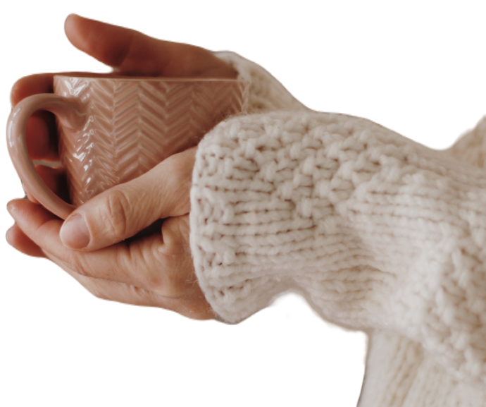 A women's hands holding a cup of tea