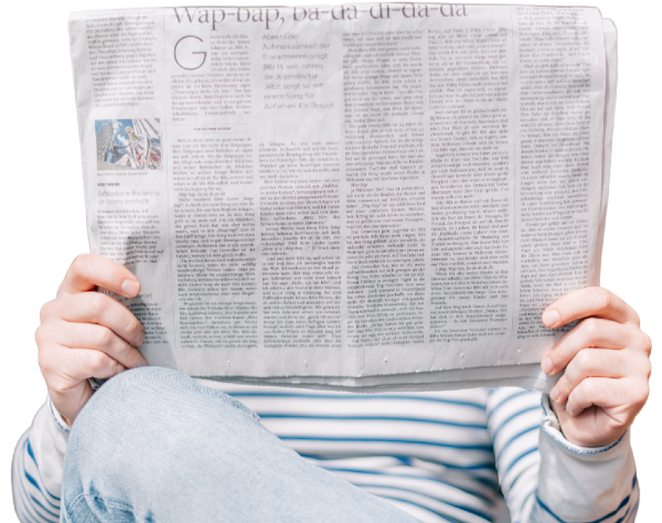 A person reading a newspaper