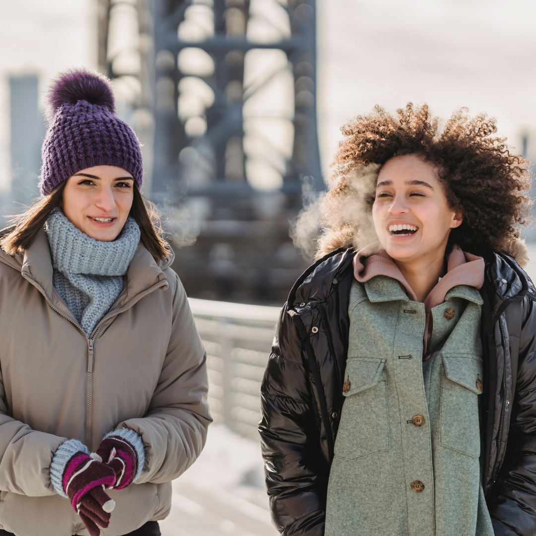 2 women walking in the cold