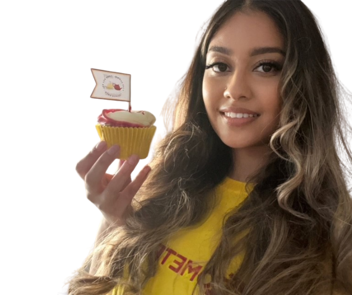 Woman holding a cupcake