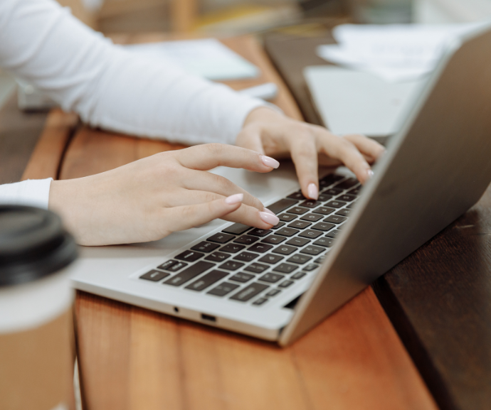 A person typing on a laptop