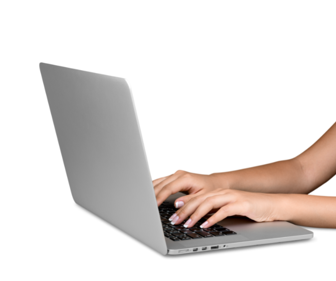A person typing on a laptop