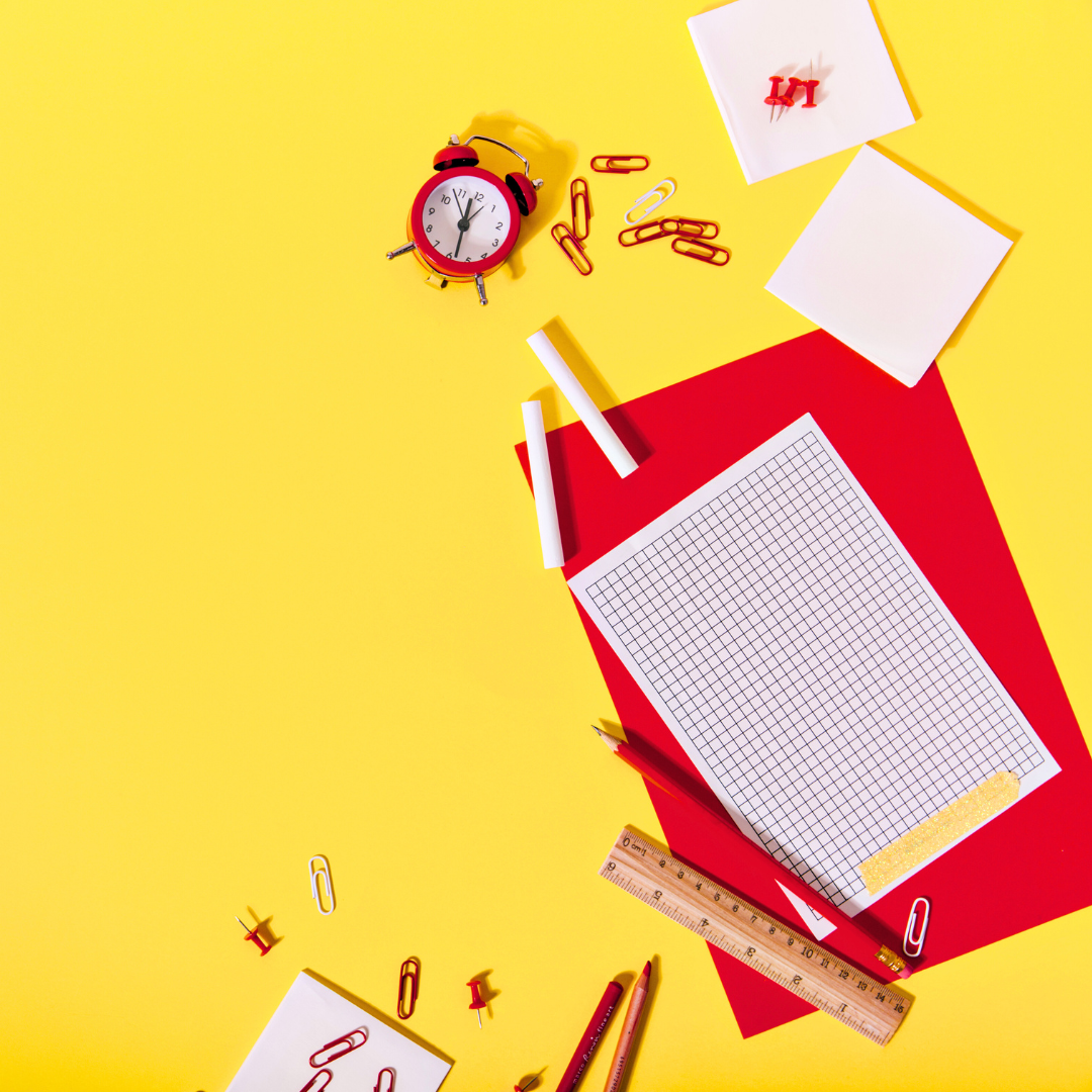Red school supplies on a yellow background