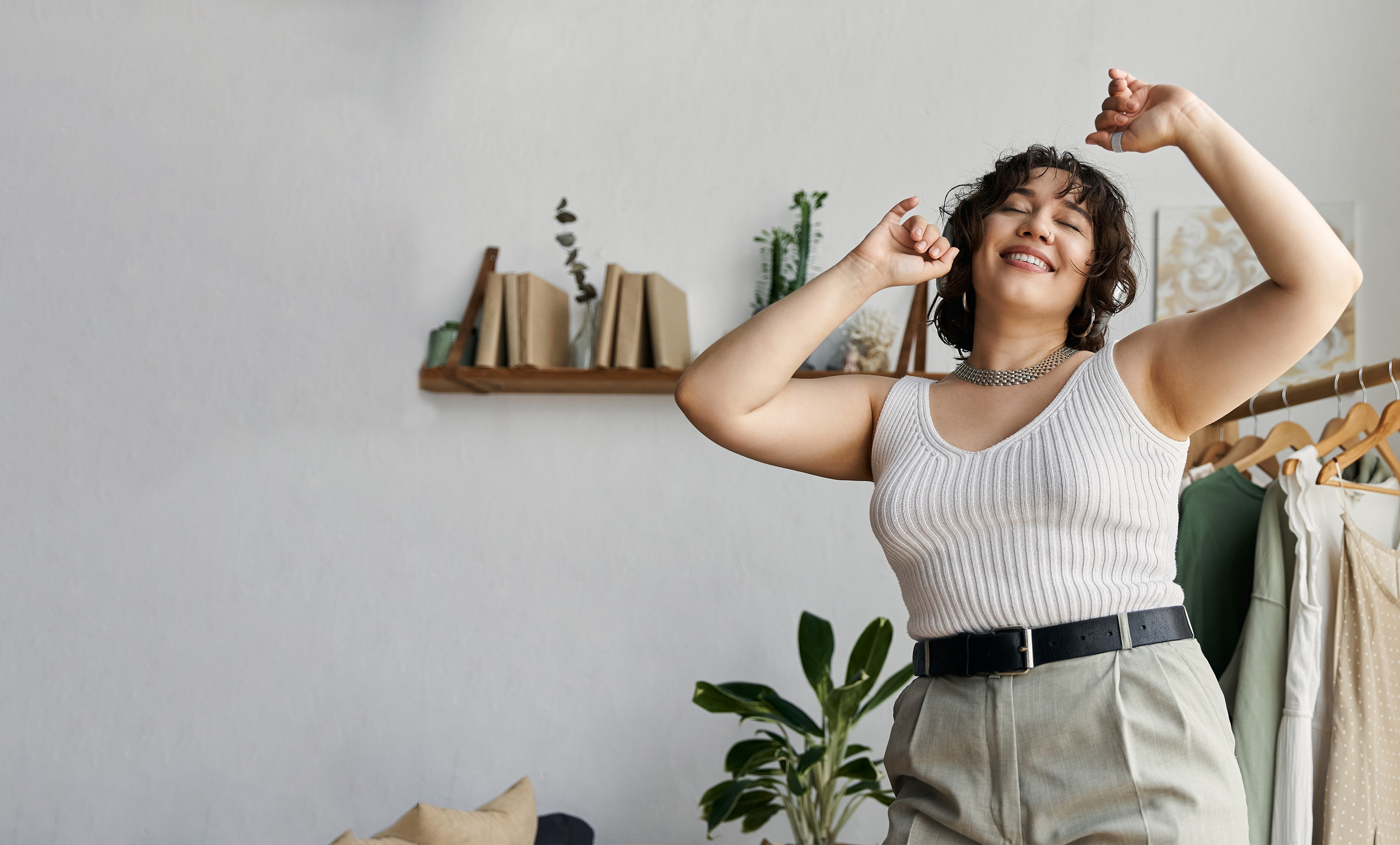 Happy Dancing Woman in her Lounge