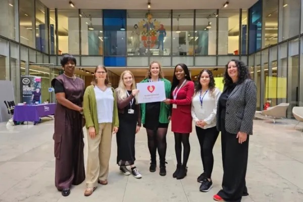 Photograph of an endometriosis friendly employer, group of women in a lobby