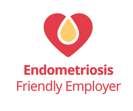 Endometriosis Friendly Employer logo on a light grey background. The design features a red heart-shaped symbol with a gold teardrop shape at its centre above the text “Endometriosis Friendly Employer” in red.