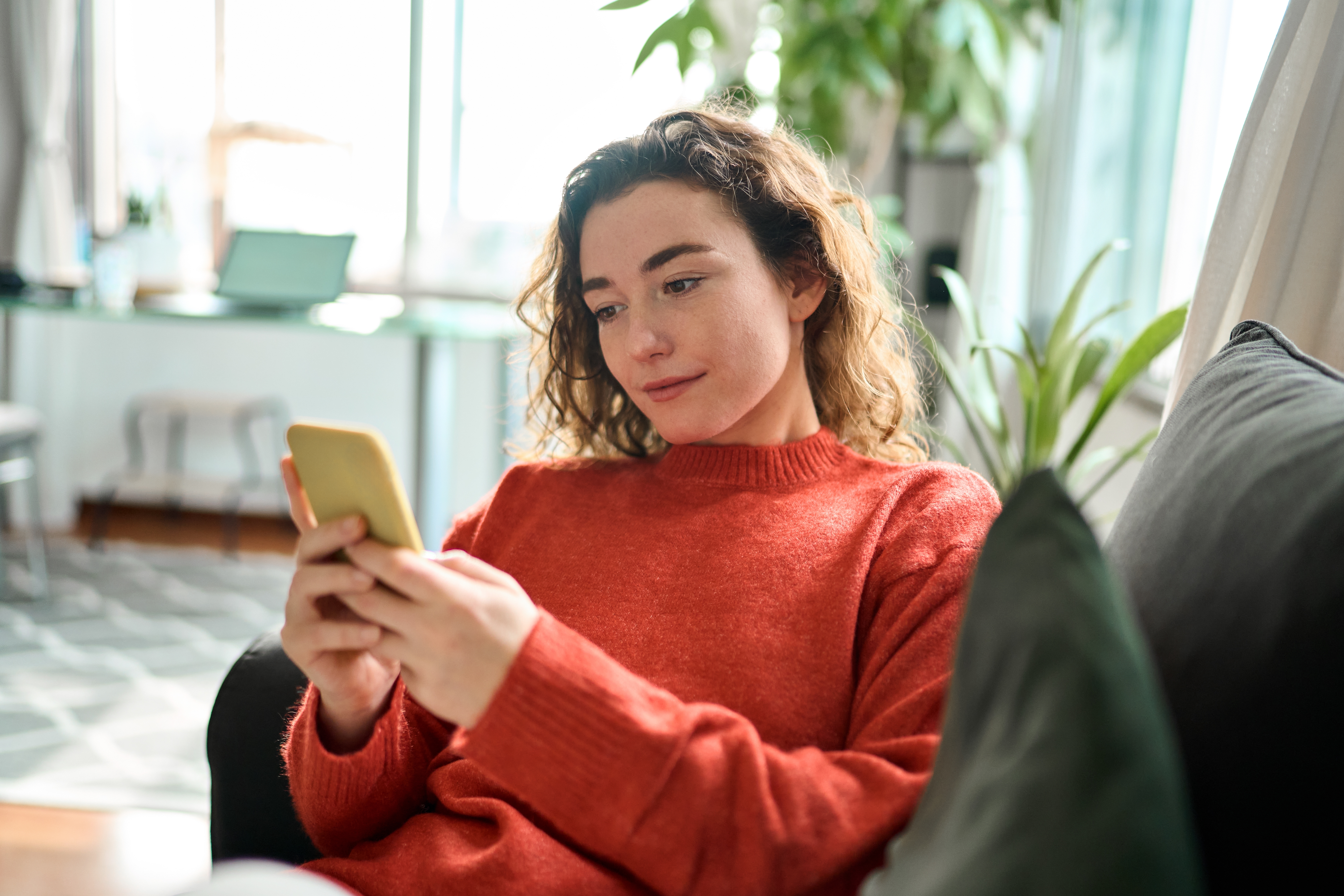 Young woman using phone