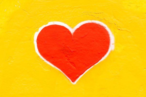 A red heart on a yellow background