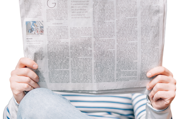 A person reading a newspaper