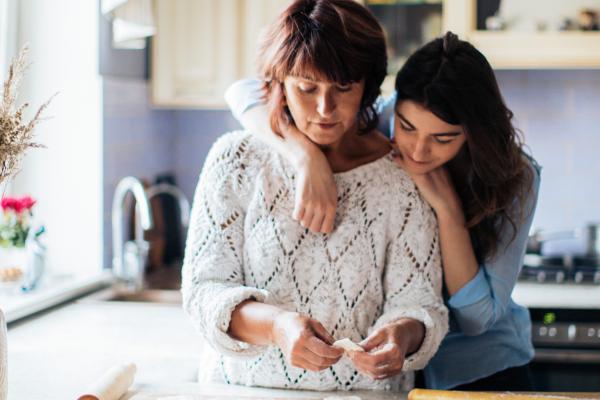 Two women hug