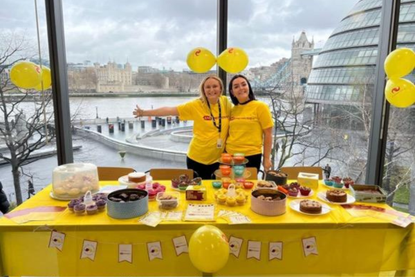 2 employees having a bake sale