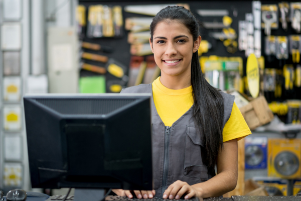 Woman working on the checkout at a hardware store