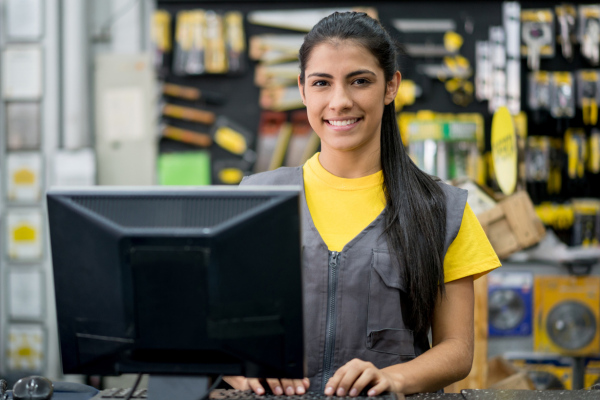 Woman working on the checkout at a hardware store 