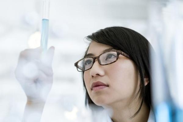 Scientist holding a pipette