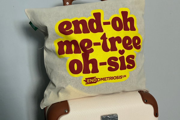 Endometriosis UK tote bag on suitcase