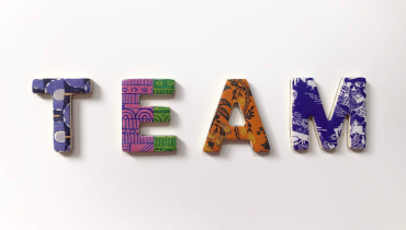 The word Team in multicoloured letters