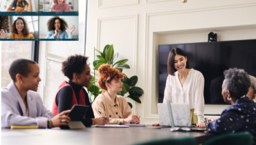 Women in face-to-face and virtual meeting