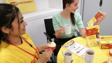 Two women at work having tea for Endo