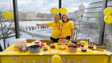 2 employees having a bake sale